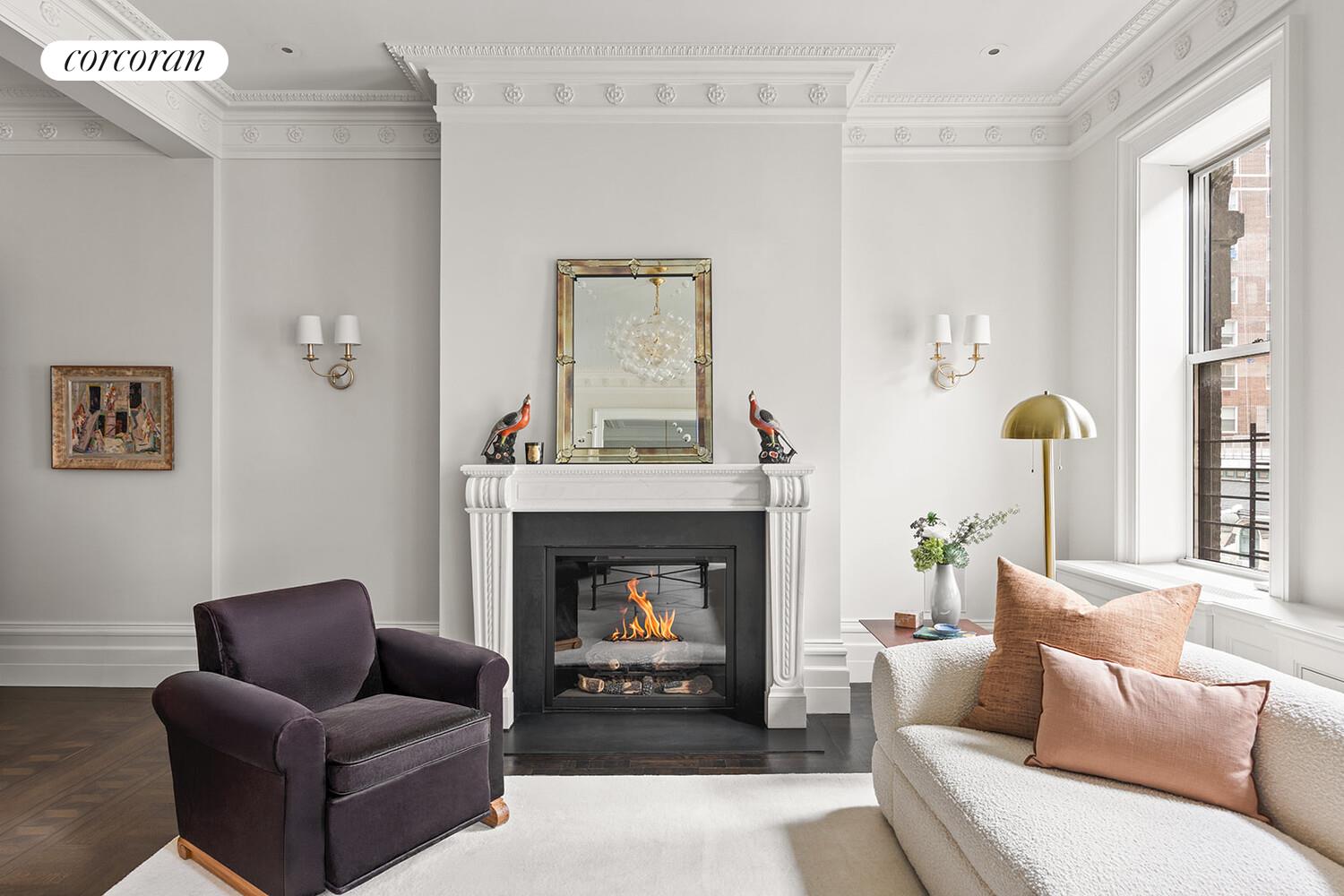 16 East 96th Street, Unit 7B Manhattan, NY 10128 - Photo 3 of 55 a living room with furniture and a fireplace