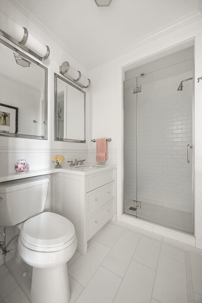 16 East 96th Street, Unit 7B Manhattan, NY 10128 - Photo 49 of 55 a bathroom with a sink a toilet and shower
