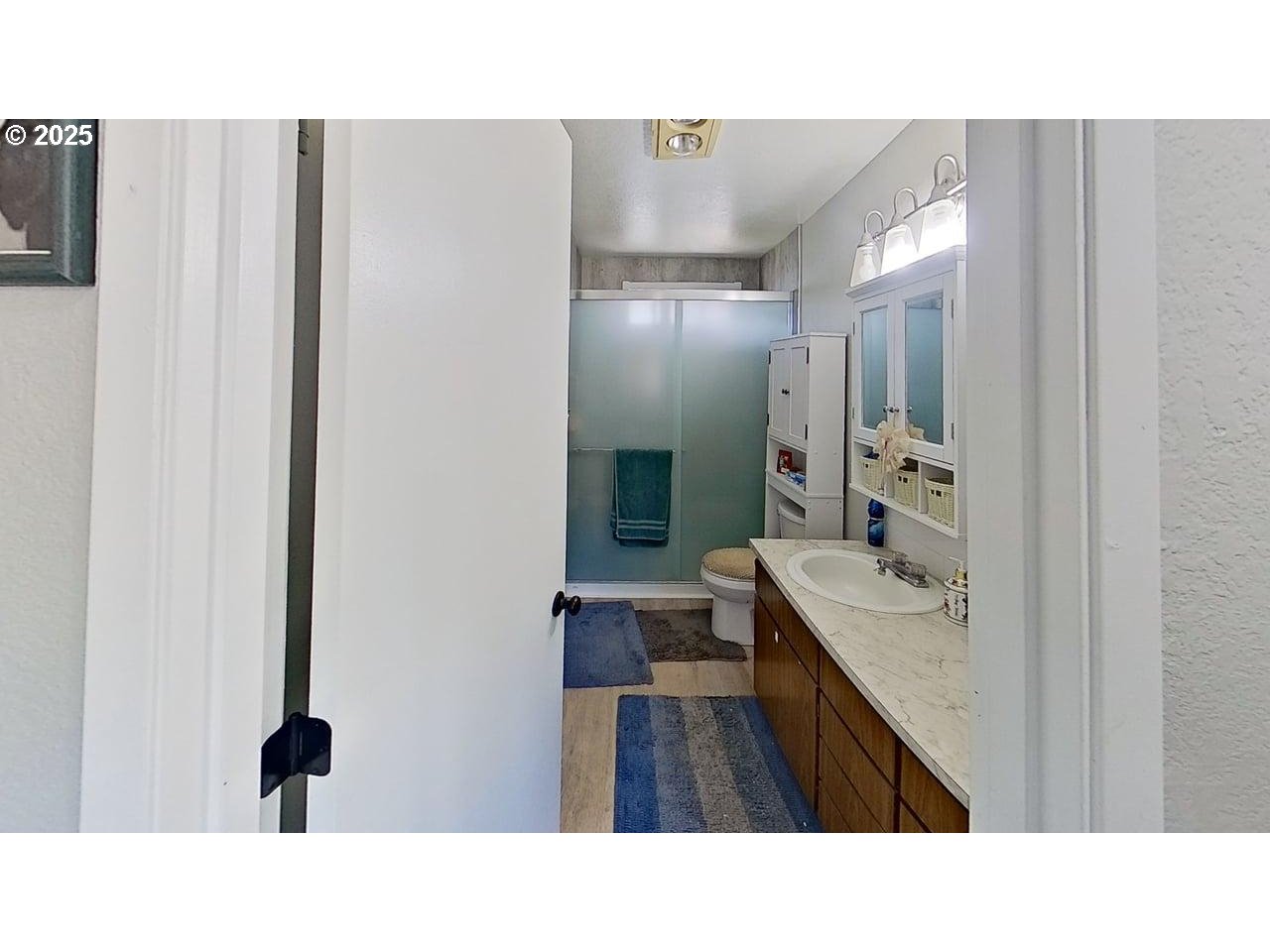 715 Penny Lane Riddle, OR 97469 - Photo 11 of 32 a upper view of a bathroom with a sink and mirror