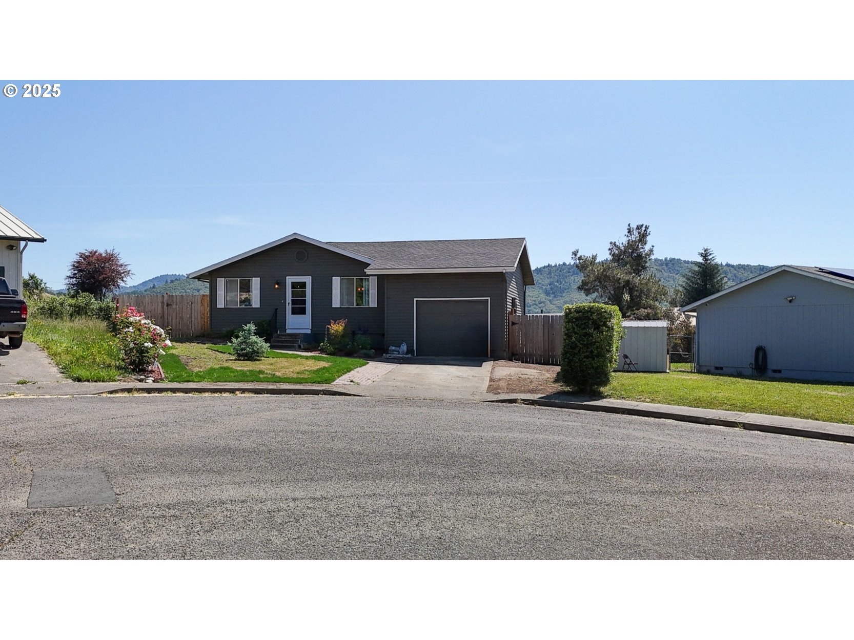 715 Penny Lane Riddle, OR 97469 - Photo 12 of 32 a house view with a outdoor space