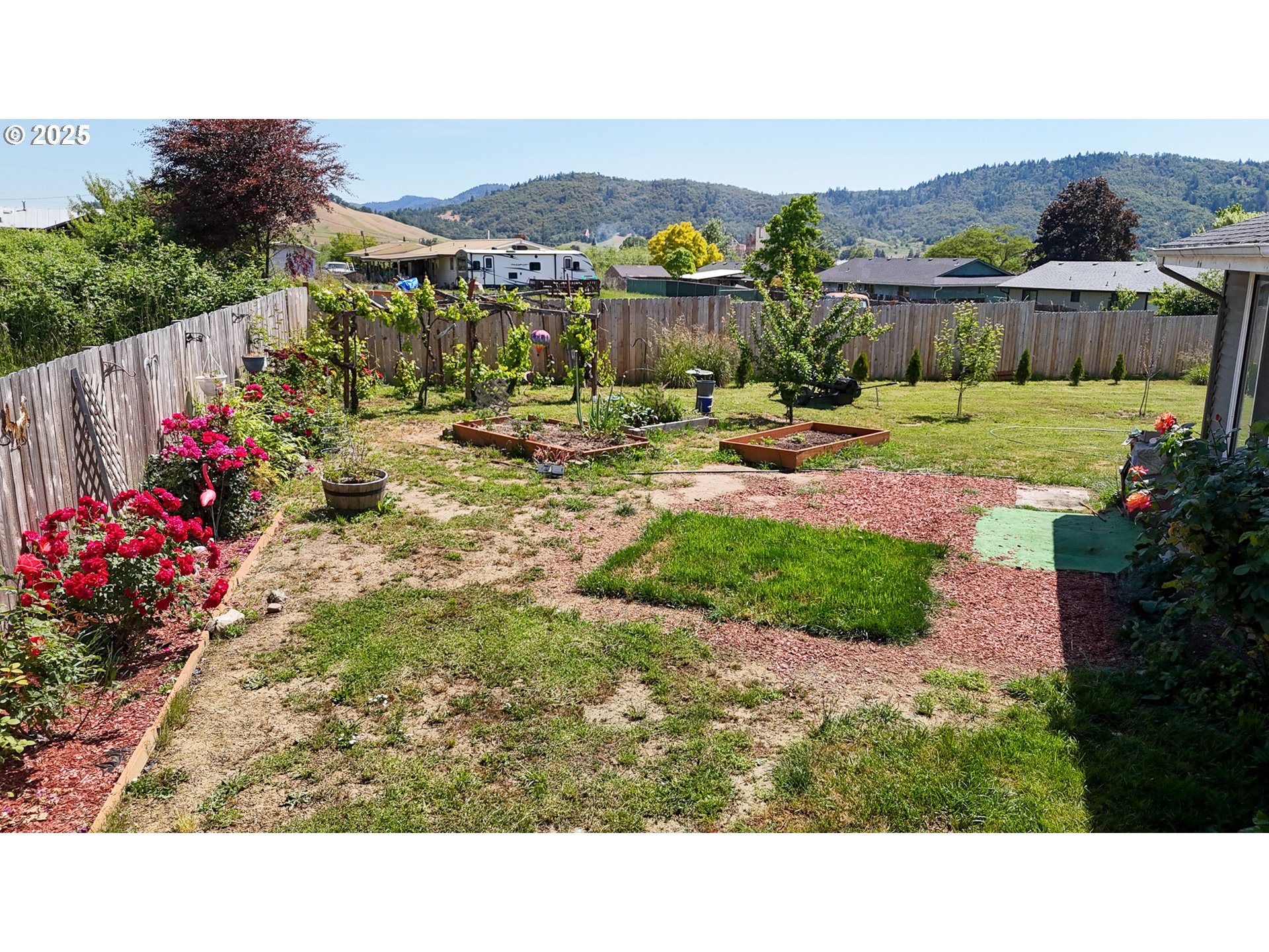 715 Penny Lane Riddle, OR 97469 - Photo 17 of 32 a view of a house with a garden