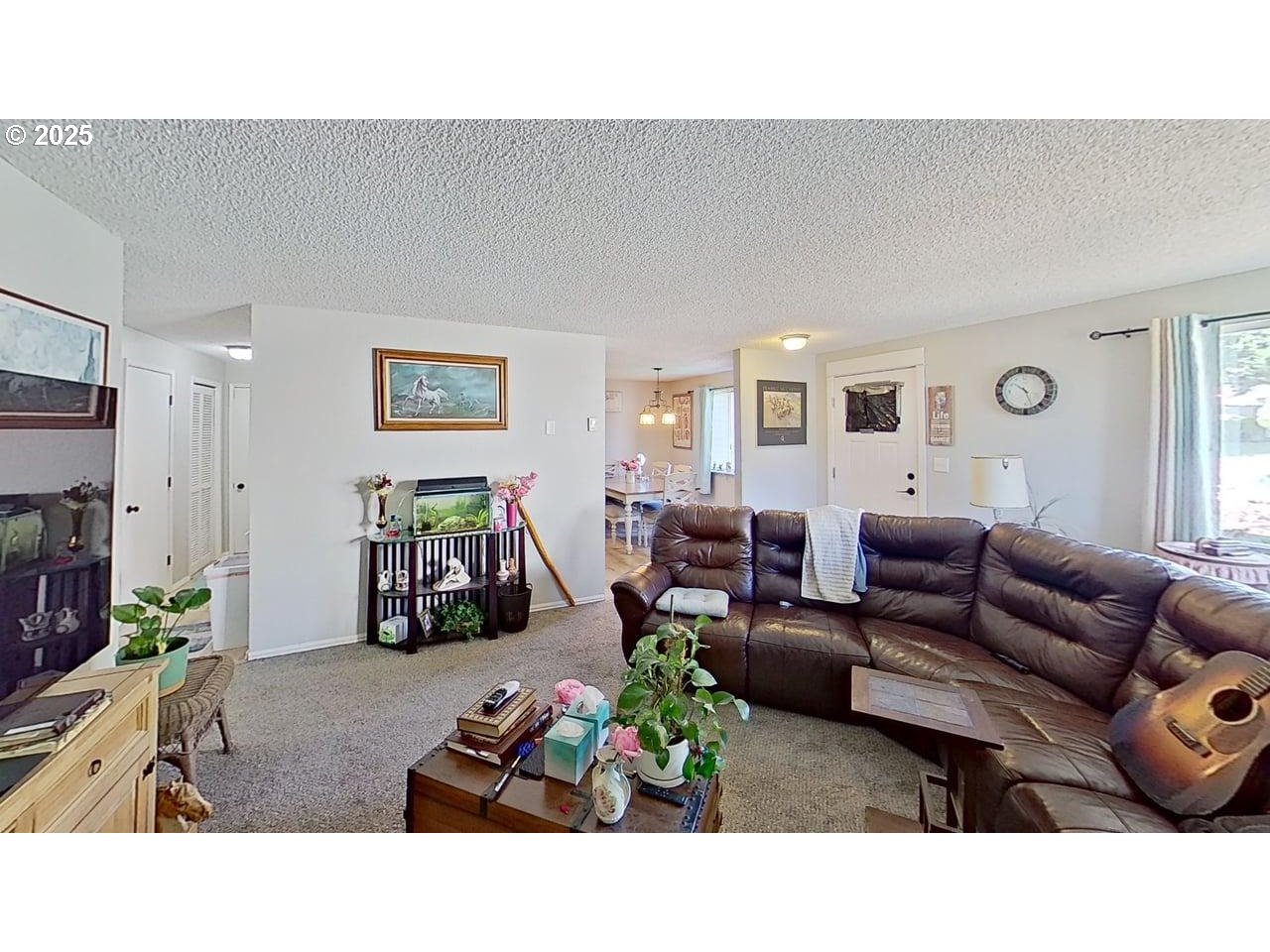 715 Penny Lane Riddle, OR 97469 - Photo 2 of 32 a living room with furniture and a flat screen tv