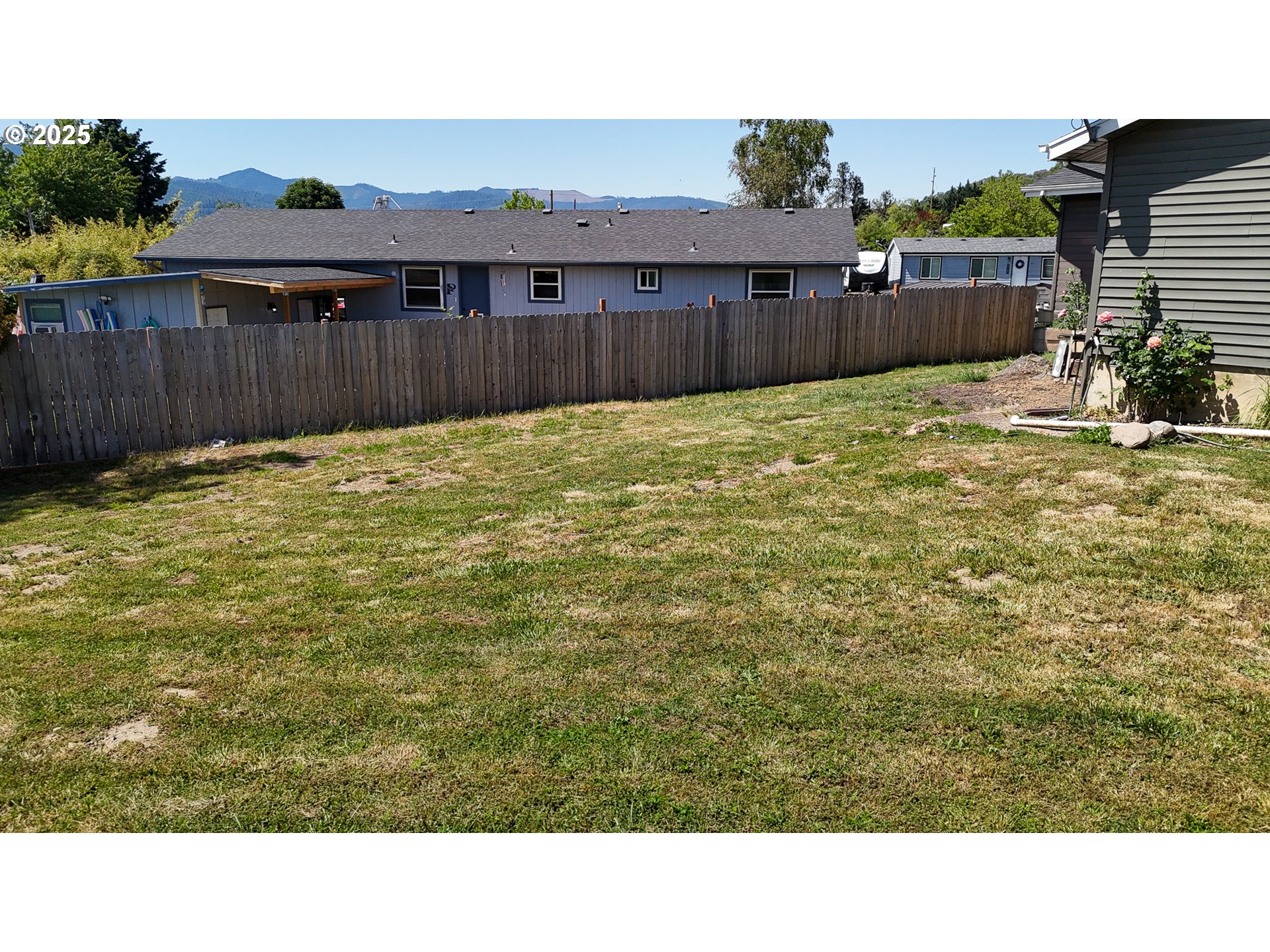 715 Penny Lane Riddle, OR 97469 - Photo 22 of 32 a view of a backyard