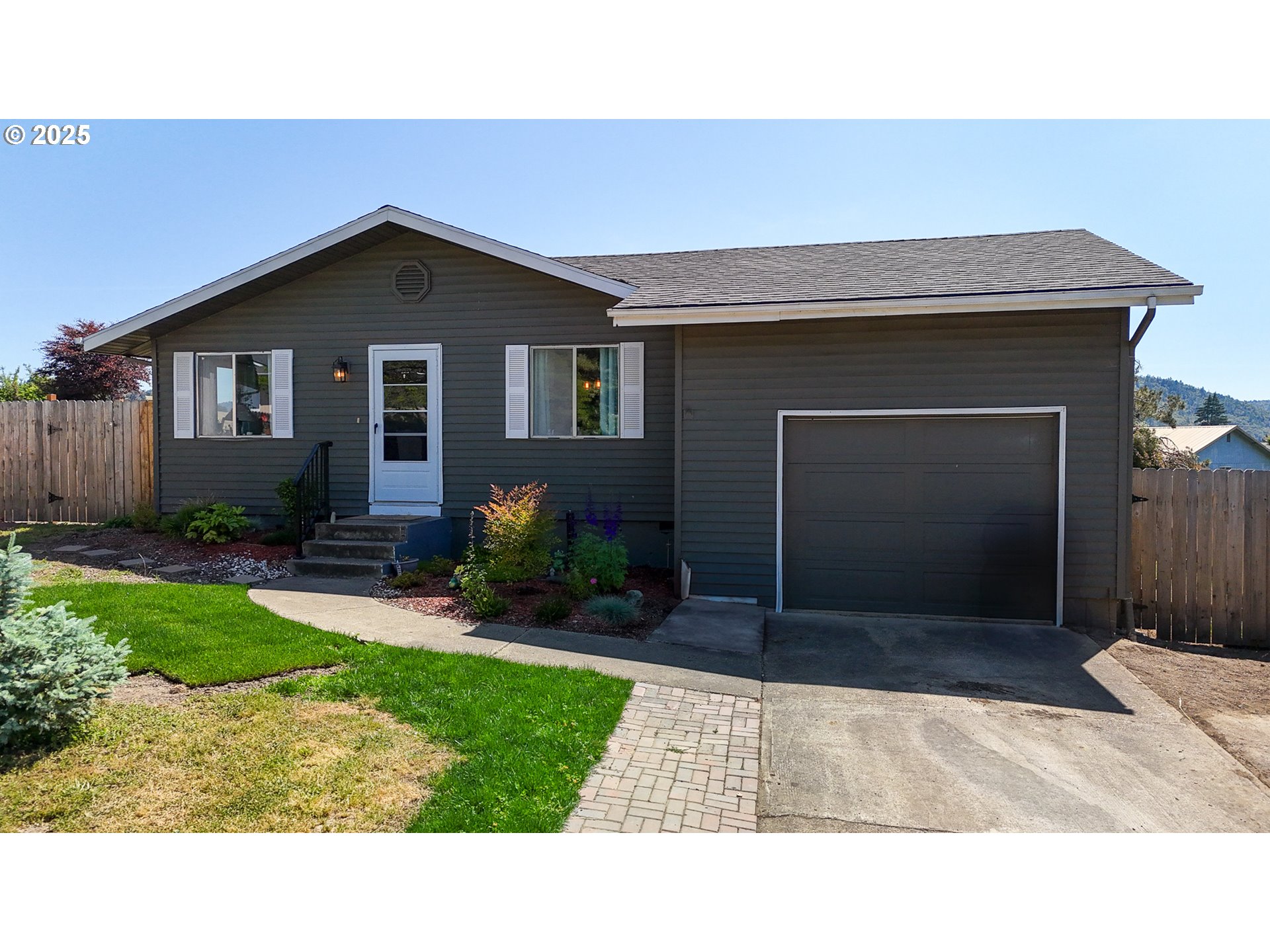 715 Penny Lane Riddle, OR 97469 - Photo 26 of 32 a house view with a outdoor space