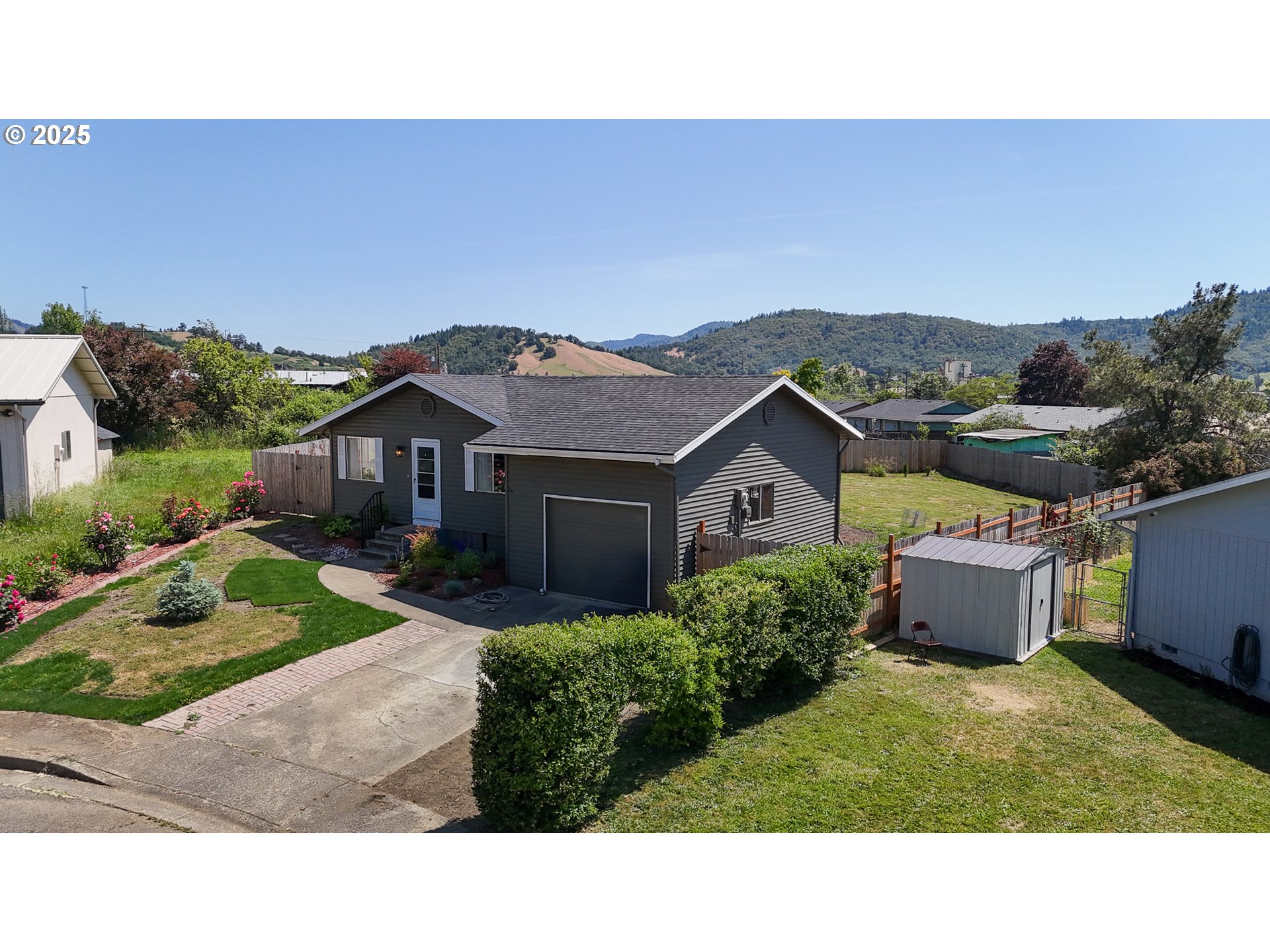 715 Penny Lane Riddle, OR 97469 - Photo 27 of 32 a house view with a garden