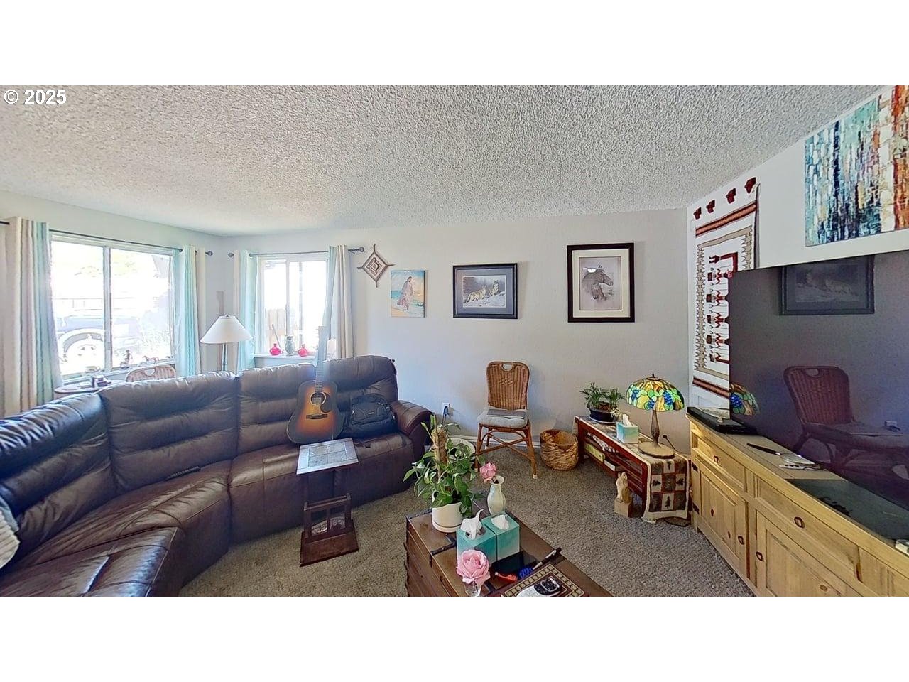 715 Penny Lane Riddle, OR 97469 - Photo 3 of 32 a living room with furniture and a flat screen tv