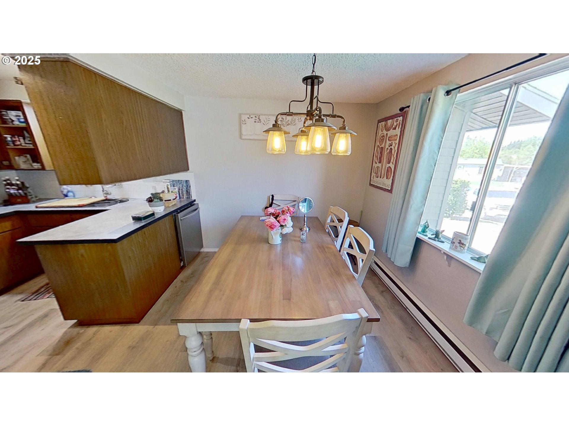 715 Penny Lane Riddle, OR 97469 - Photo 4 of 32 a living room with a couch and a flat screen tv