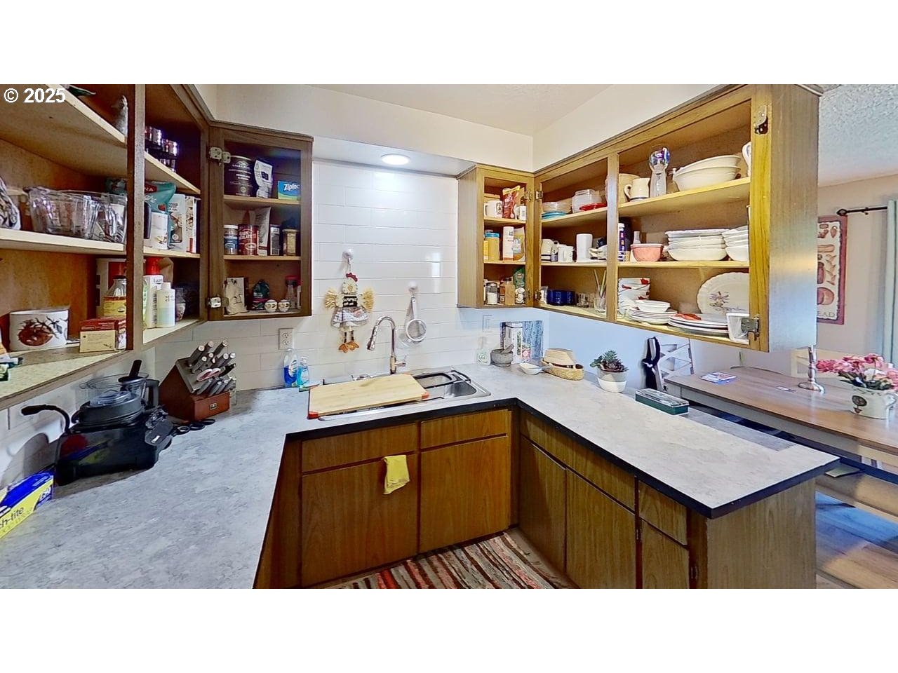 715 Penny Lane Riddle, OR 97469 - Photo 5 of 32 a kitchen with stainless steel appliances a sink counter space and a window