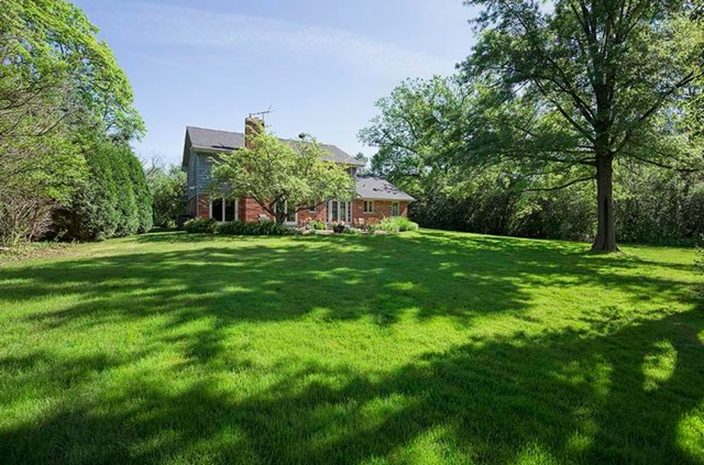 401 Voltz Road Northbrook, IL 60062 - Photo 11 of 13 a big yard with lots of green space and trees