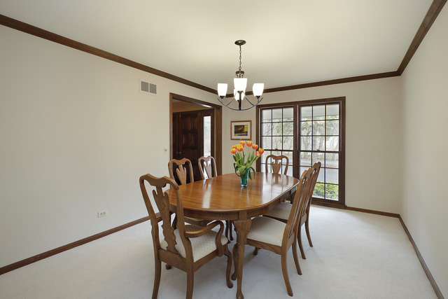 401 Voltz Road Northbrook, IL 60062 - Photo 5 of 13 a view of a dining room with furniture a chandelier and wooden floor