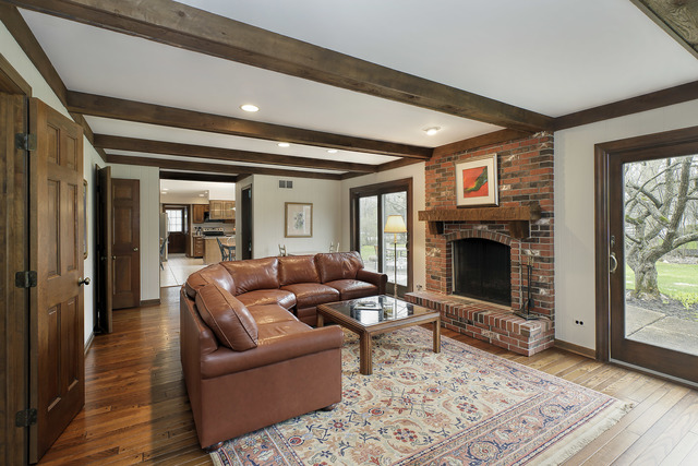 401 Voltz Road Northbrook, IL 60062 - Photo 6 of 13 a living room with furniture and a fireplace