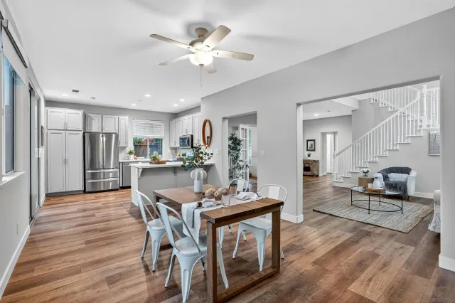 a view of a dining room with furniture and wooden floor