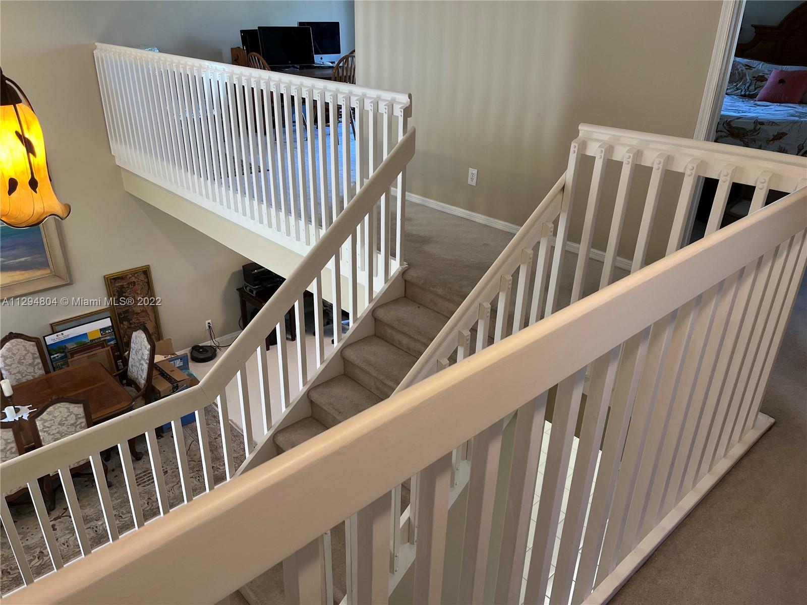 18249 Southwest 3rd Street Pembroke Pines, FL 33029 - Photo 12 of 40 a view of staircase with railing and white walls