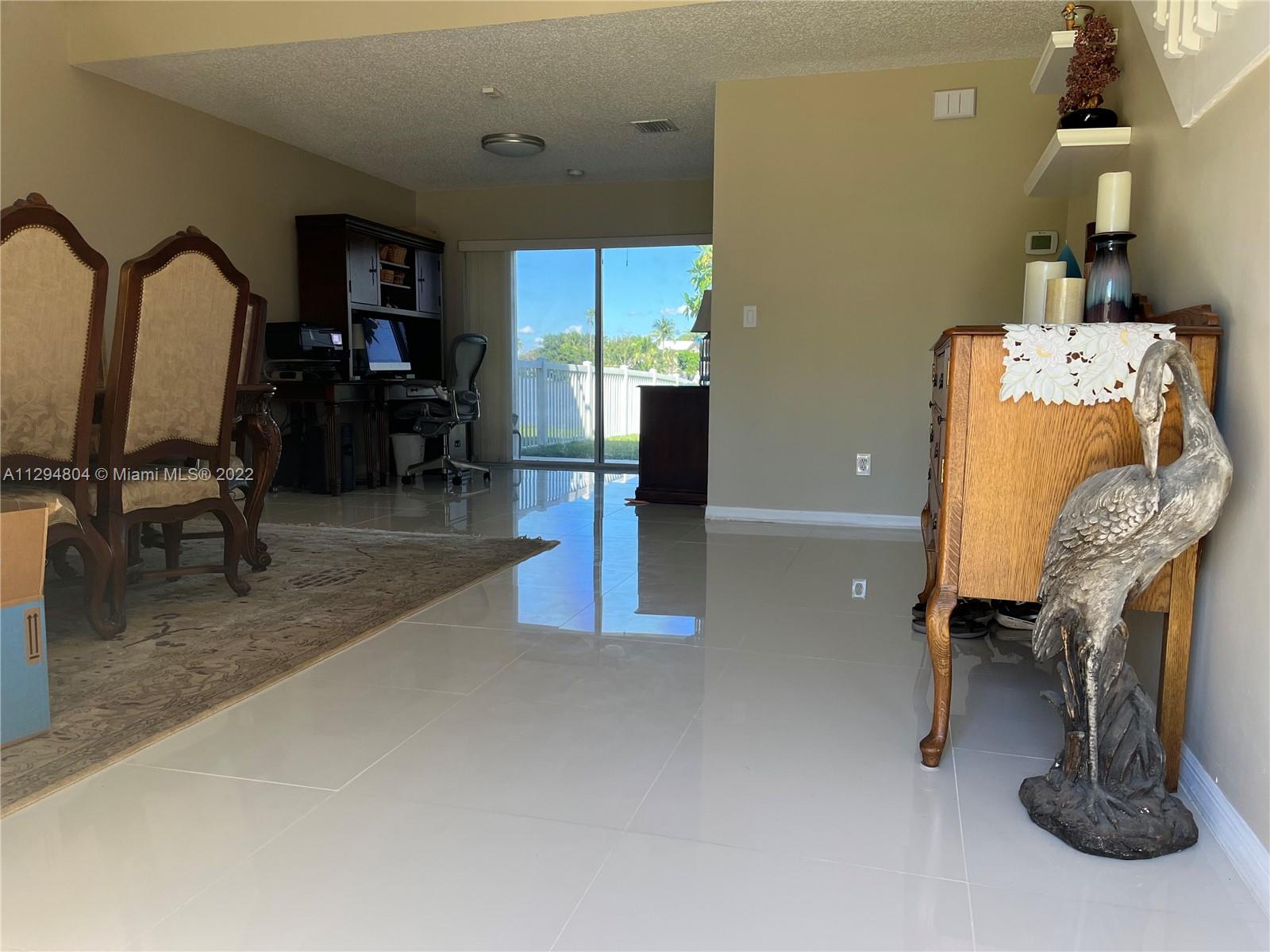 18249 Southwest 3rd Street Pembroke Pines, FL 33029 - Photo 2 of 40 a living room with furniture