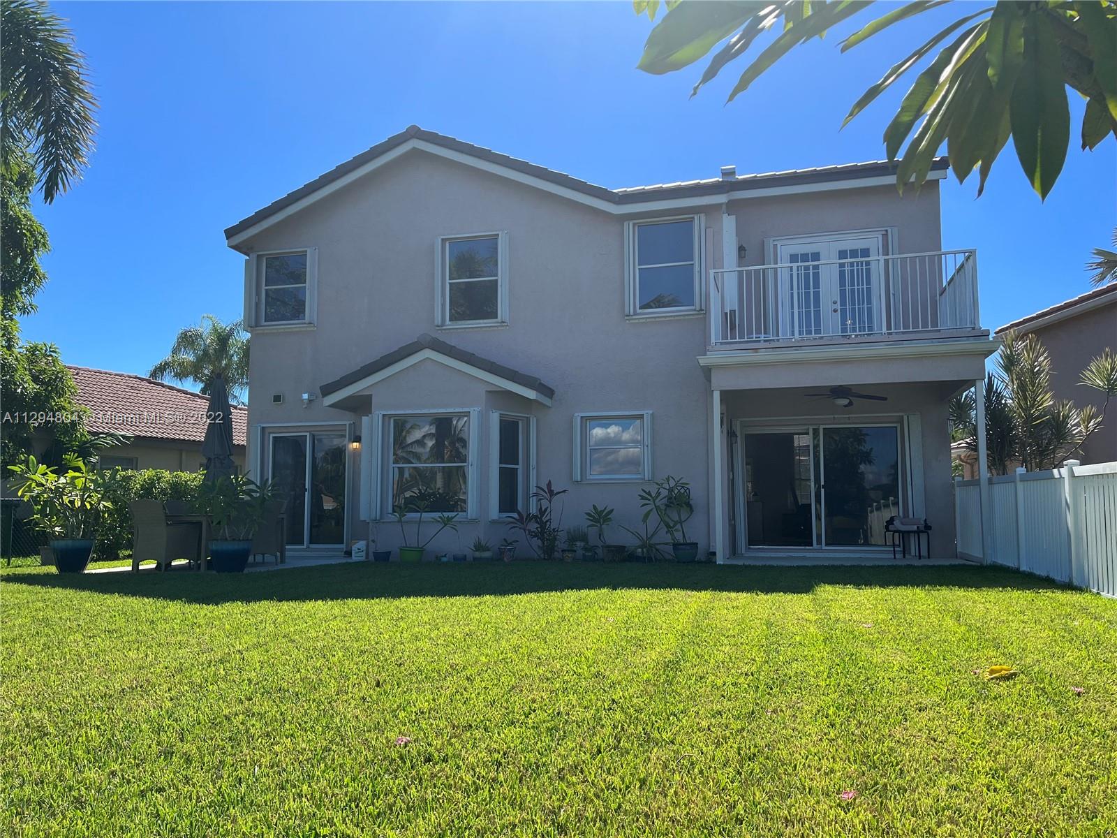 18249 Southwest 3rd Street Pembroke Pines, FL 33029 - Photo 23 of 40 a view of a house with a backyard