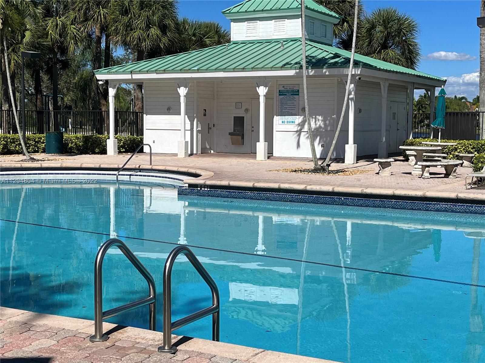 18249 Southwest 3rd Street Pembroke Pines, FL 33029 - Photo 34 of 40 a balcony with table and chairs
