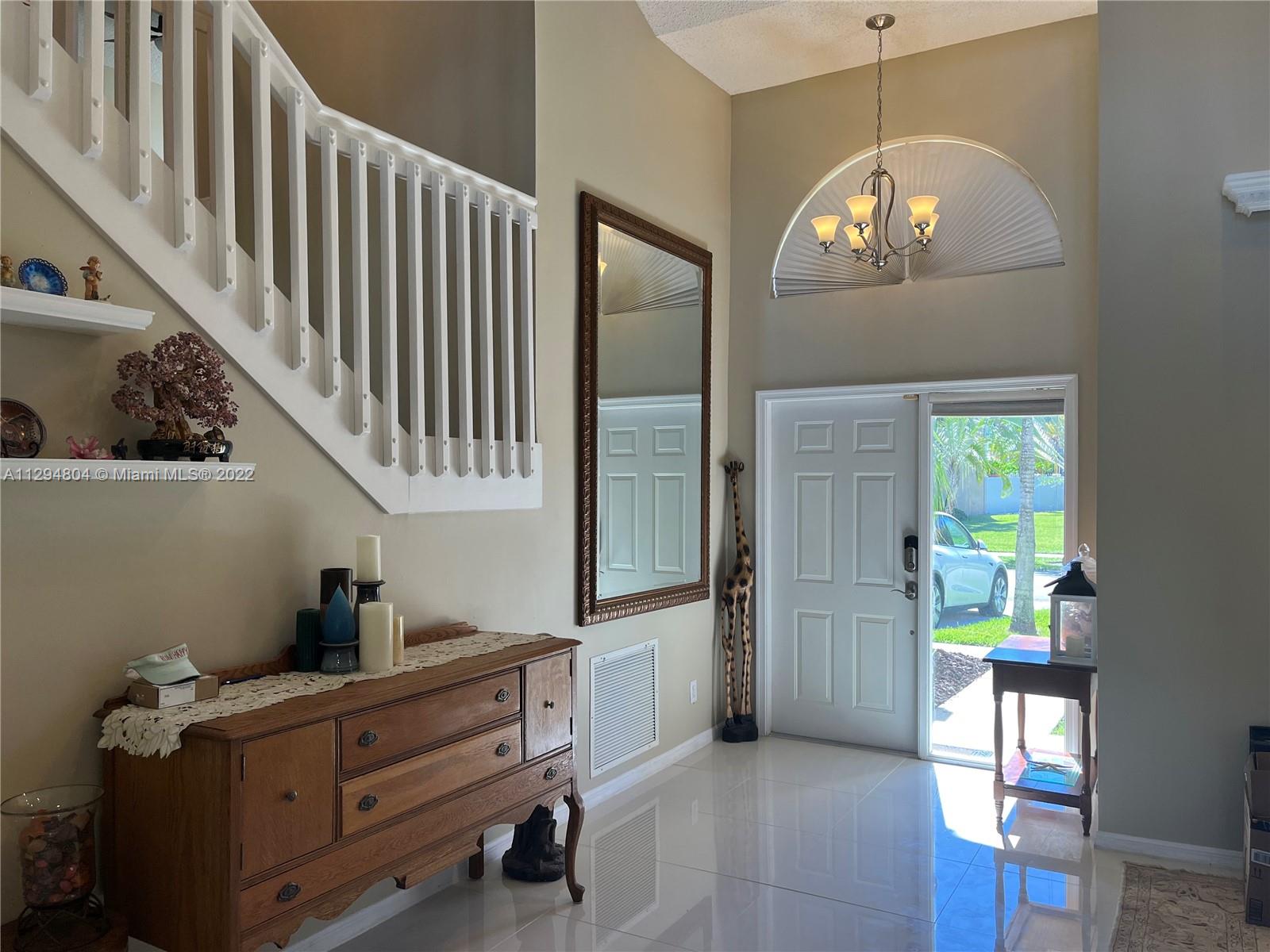 18249 Southwest 3rd Street Pembroke Pines, FL 33029 - Photo 5 of 40 a view of hall way with furniture