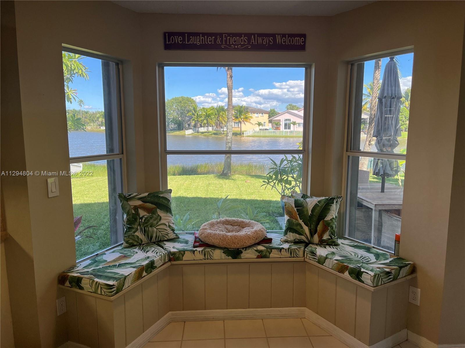 18249 Southwest 3rd Street Pembroke Pines, FL 33029 - Photo 10 of 40 a room with furniture a window and a potted plant