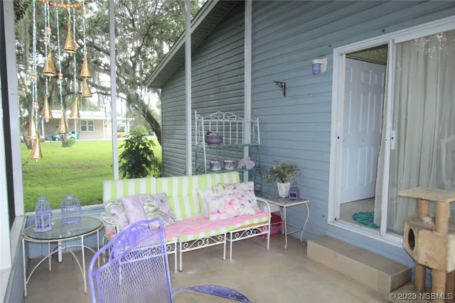 a view of a bench in the garden of a house
