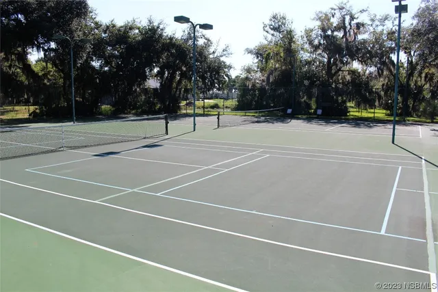 a view of a balcony with wooden floor and lake view