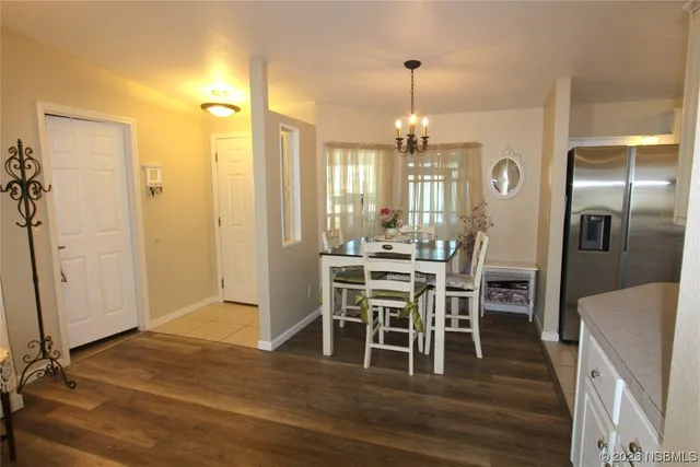 a kitchen with stainless steel appliances a refrigerator sink and cabinets