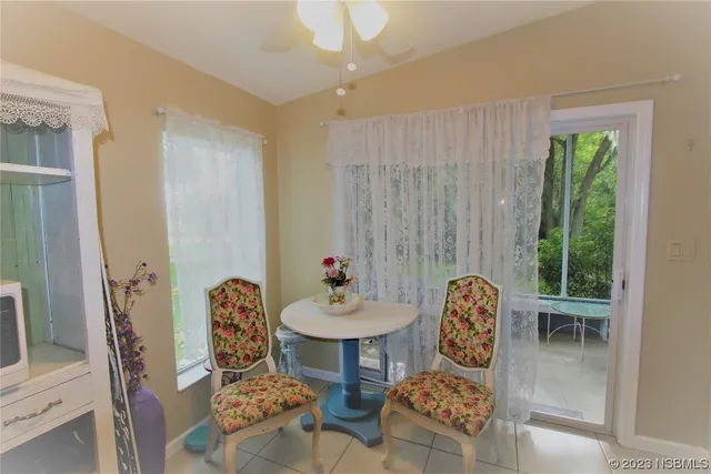 a bathroom with a sink vanity and shower