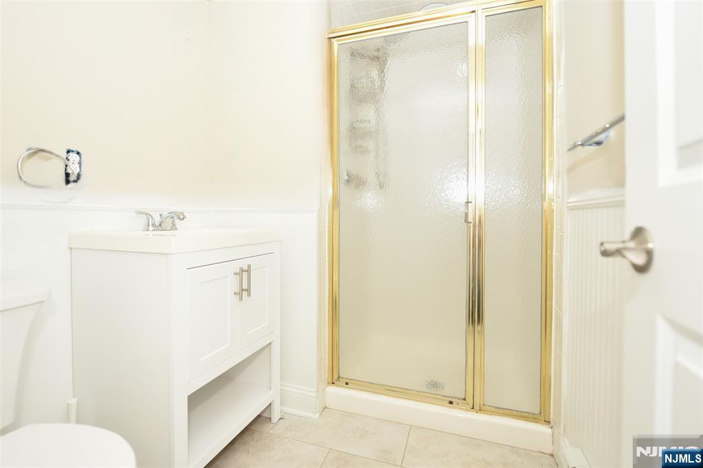 105 Parkway Rochelle Park, NJ 07662 - Photo 20 of 22 a bathroom with a sink a toilet and shower