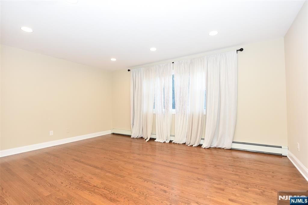 105 Parkway Rochelle Park, NJ 07662 - Photo 2 of 22 a view of wooden floor and entryway in a room