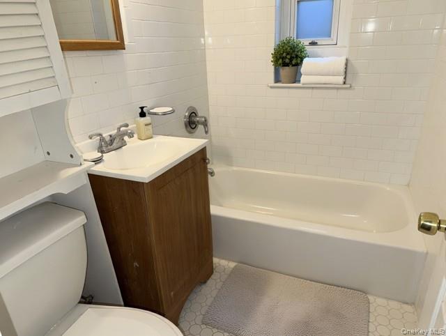 2832 Harding Avenue Bronx, NY 10465 - Photo 12 of 23 a bathroom with a sink a toilet and shower