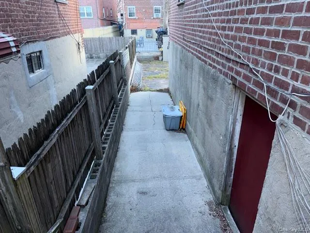 a picture of a bench in front of gate