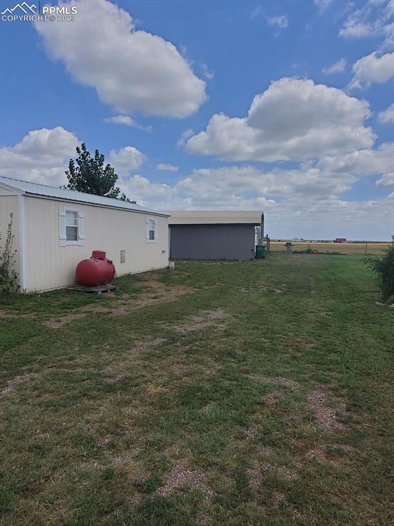 29088 County Road South Karval, CO 80823 - Photo 22 of 37 a backyard of a house with lots of green space