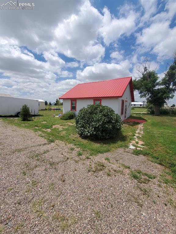 29088 County Road South Karval, CO 80823 - Photo 3 of 37 a view of a house with a big yard plants and trees