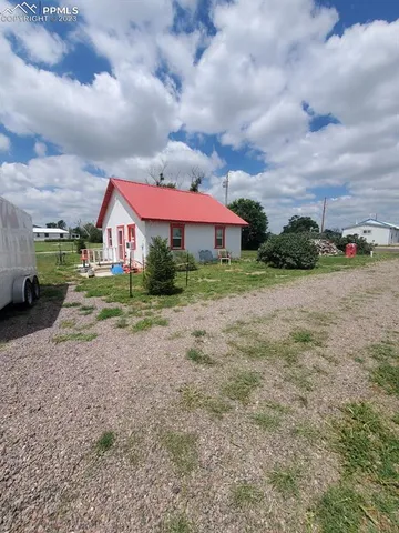 a view of a town with barn house
