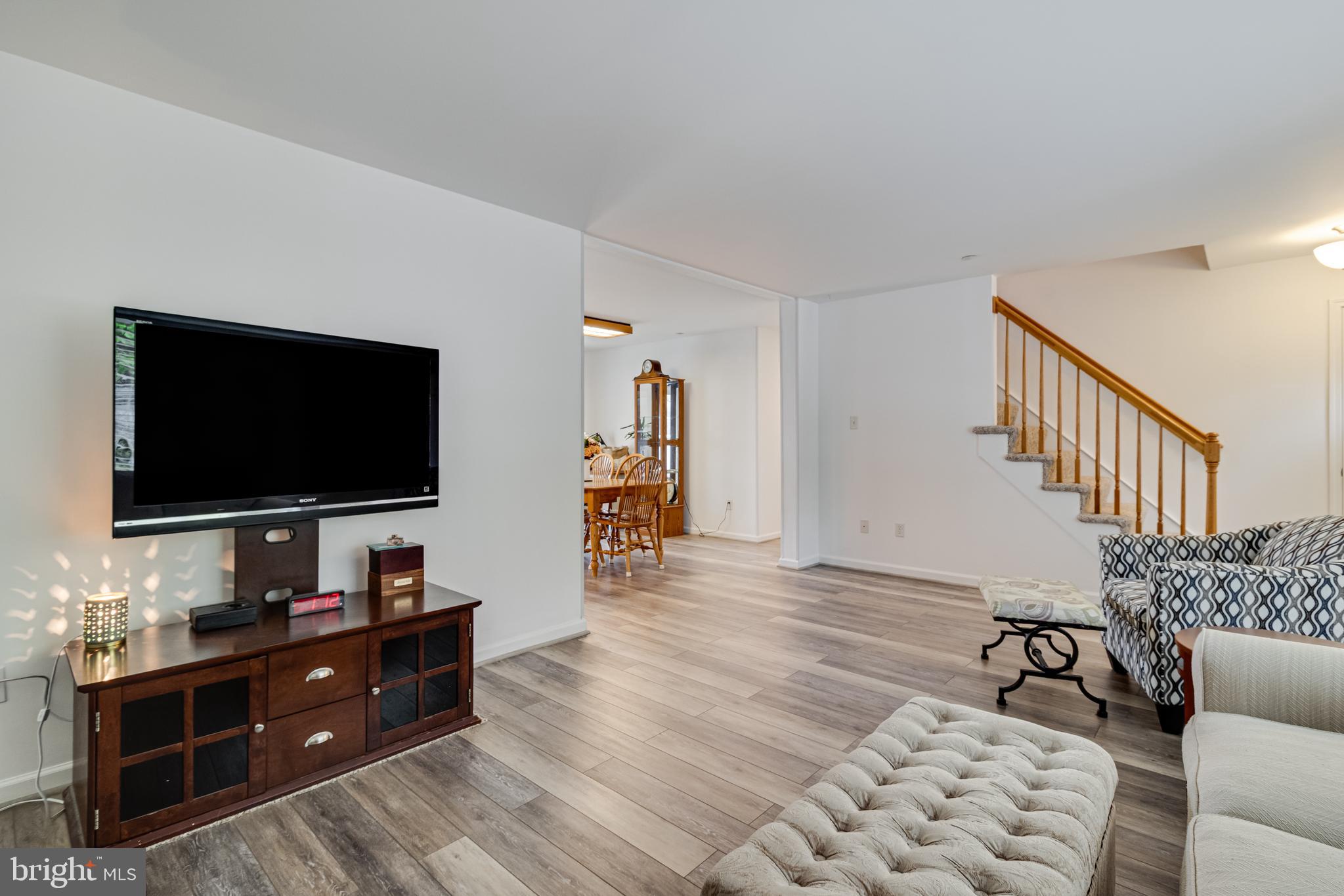 12015 Woodbury Road Nanjemoy, MD 20662 - Photo 16 of 53 a living room with furniture and a flat screen tv
