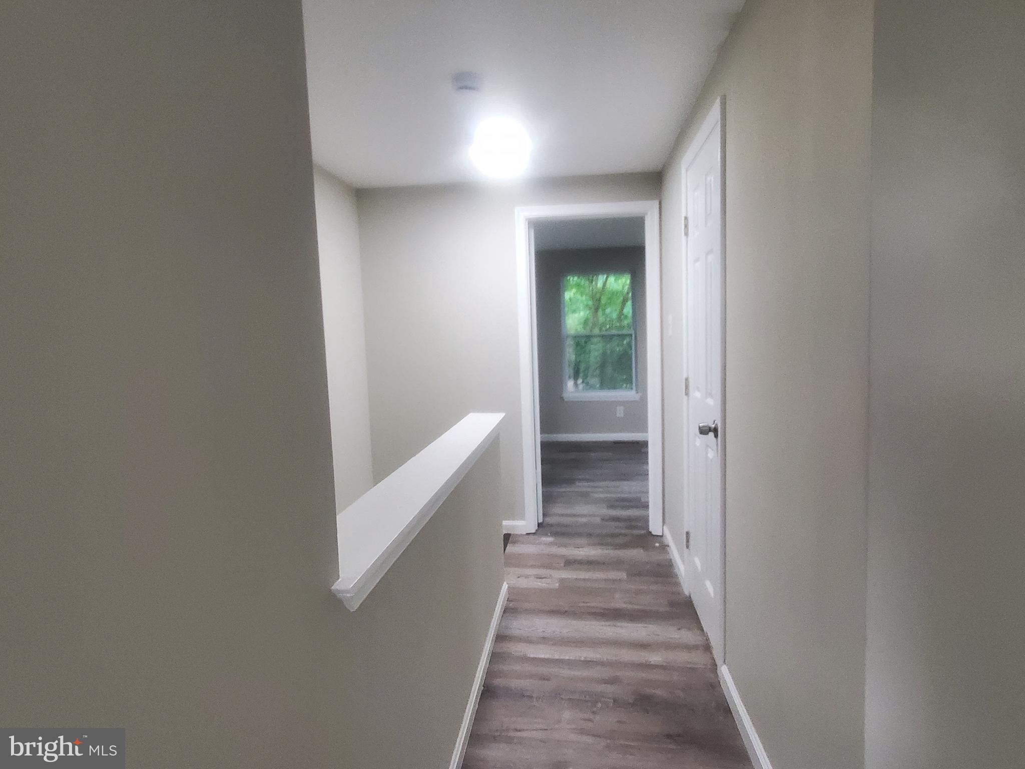14813 Hammersmith Circle Silver Spring, MD 20906 - Photo 18 of 36 a view of a hallway with wooden floor and entryway