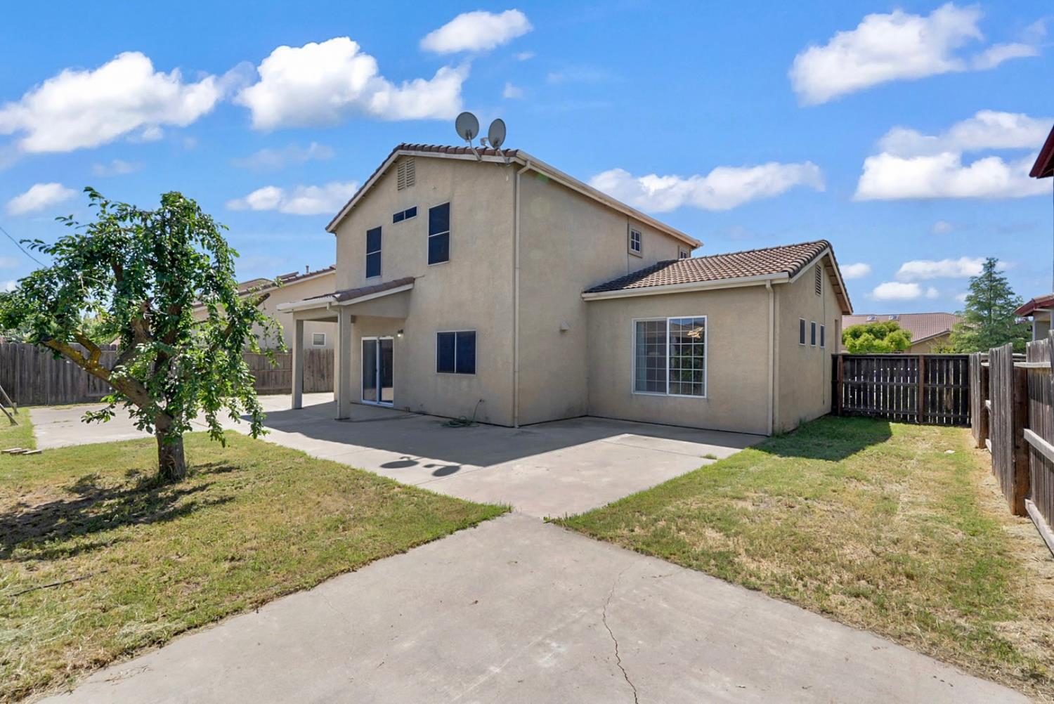 1412 Red Ribbons Lane Manteca, CA 95337 - Photo 15 of 32 a view of a house with a yard