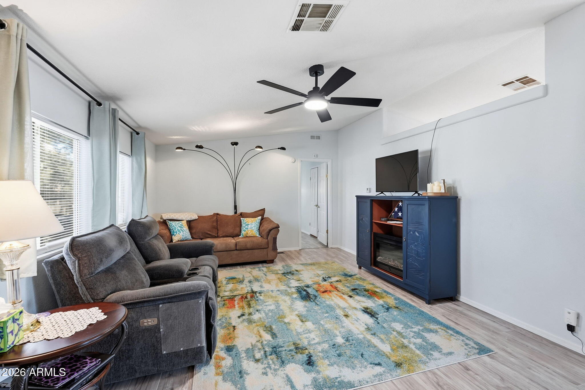 816 North Ridgeview Place Huachuca City, AZ 85616 - Photo 10 of 46 a living room with furniture and a flat screen tv