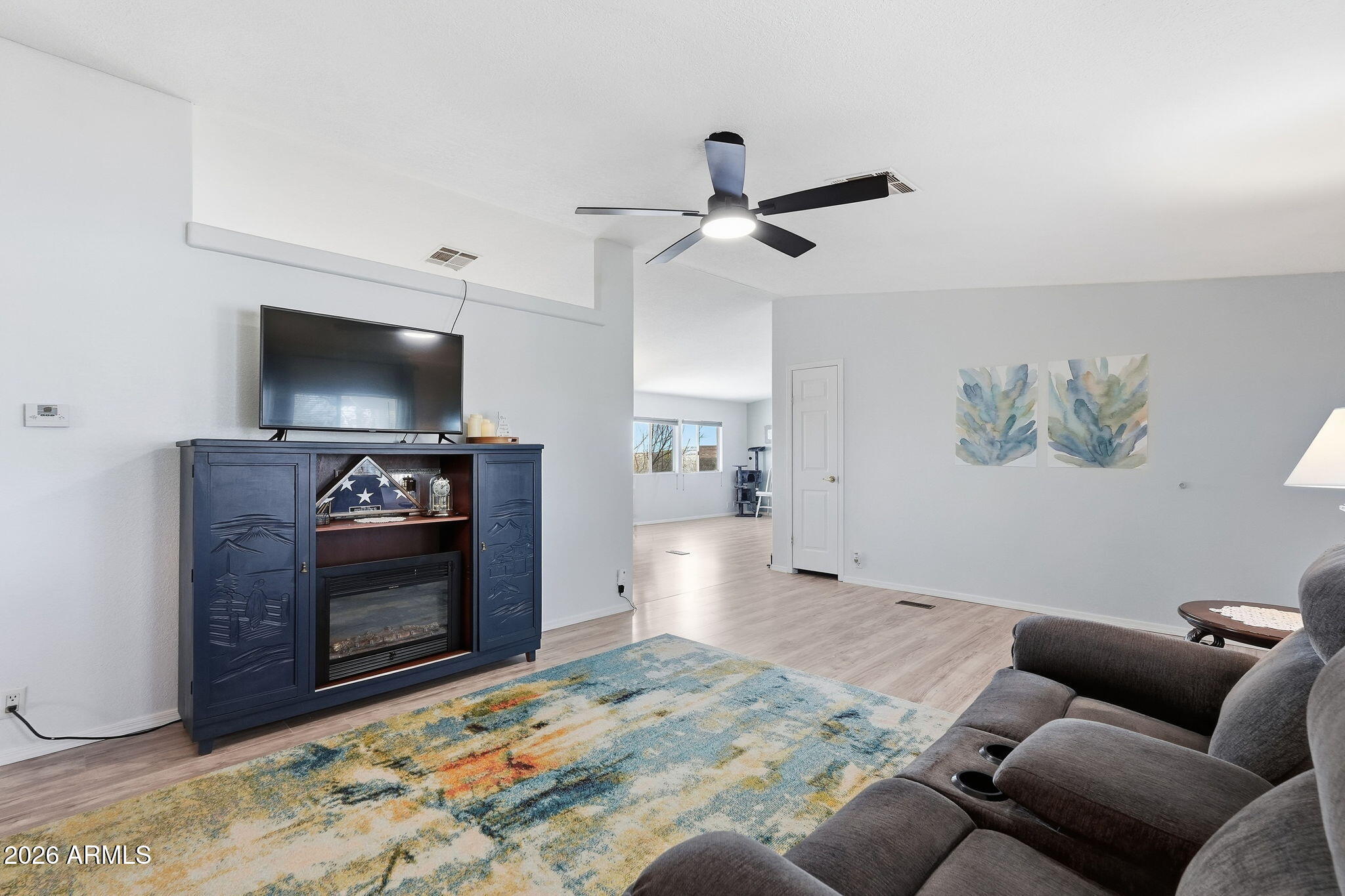 816 North Ridgeview Place Huachuca City, AZ 85616 - Photo 11 of 46 a living room with furniture and a fireplace
