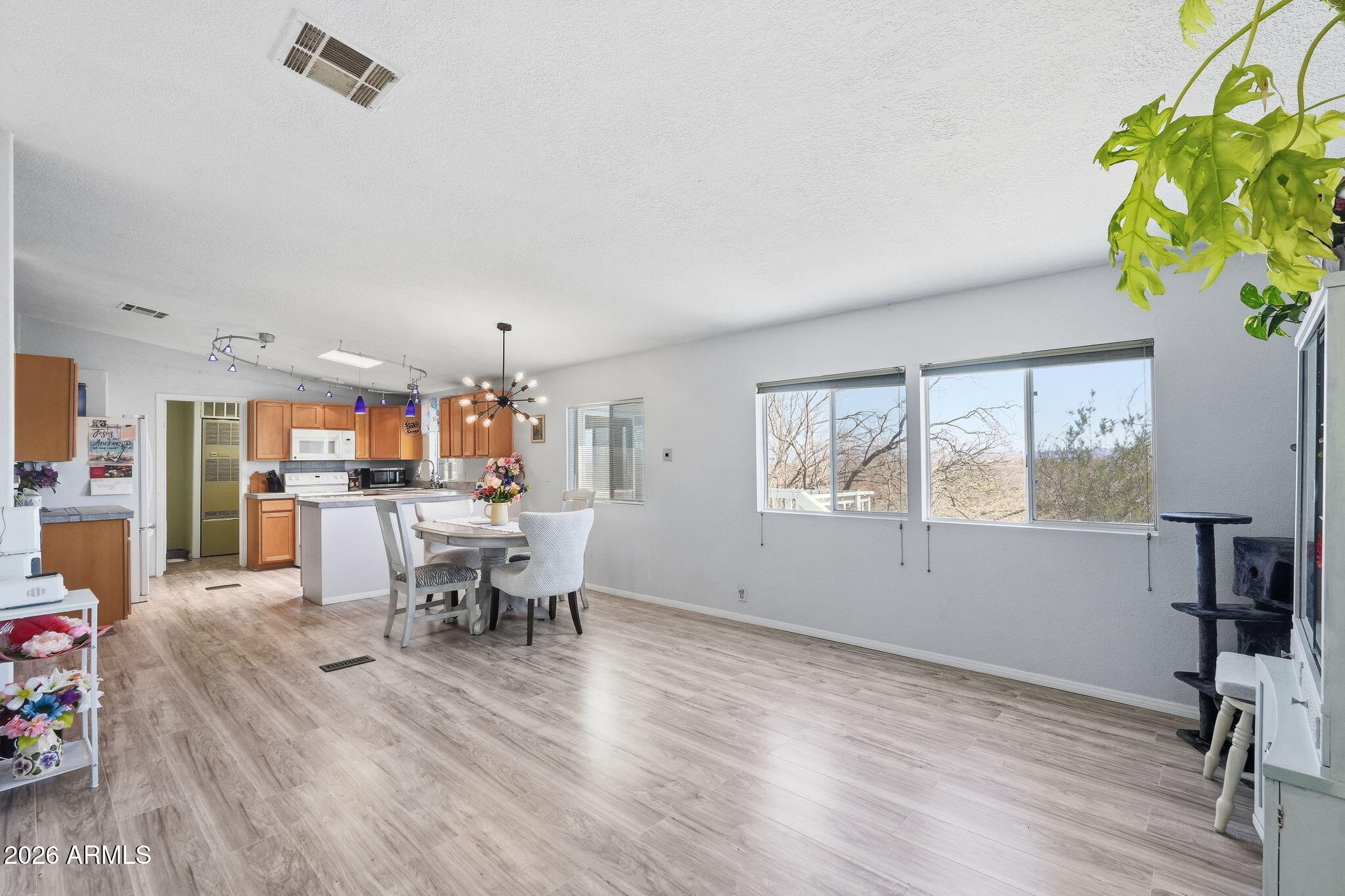 816 North Ridgeview Place Huachuca City, AZ 85616 - Photo 12 of 46 a view of a dining room with furniture window and wooden floor