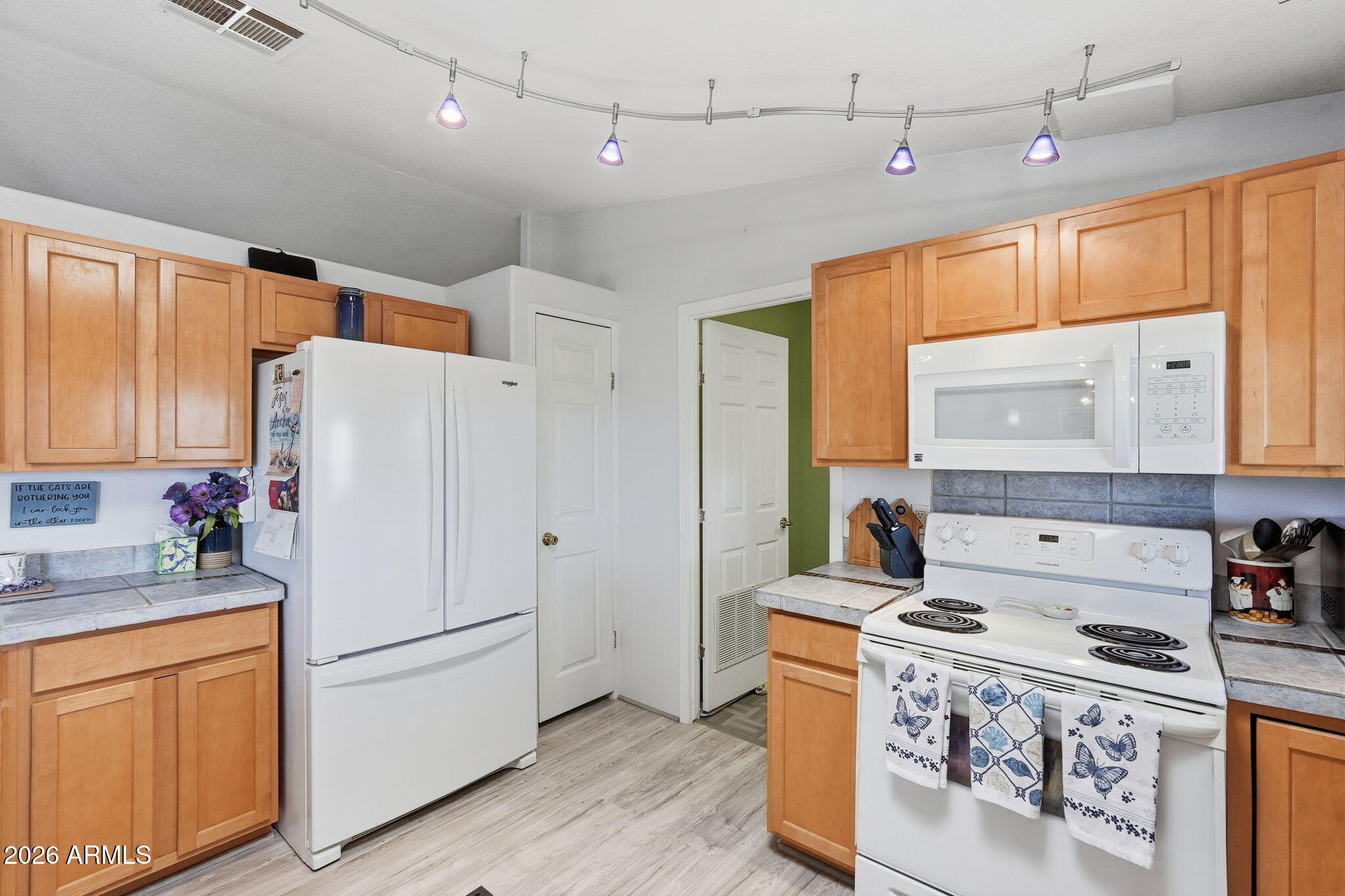 816 North Ridgeview Place Huachuca City, AZ 85616 - Photo 20 of 46 a kitchen with a stove a refrigerator and a stove