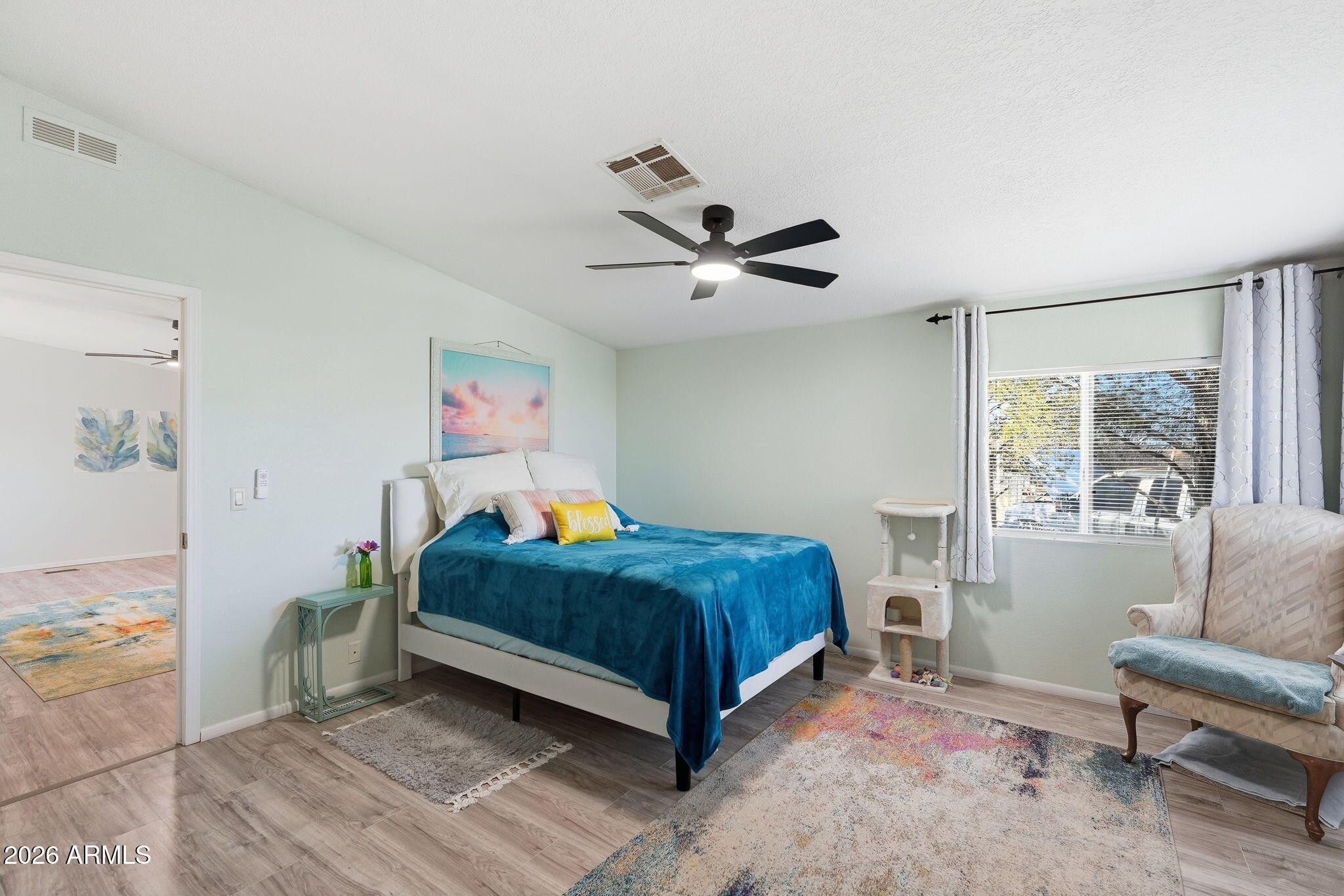 816 North Ridgeview Place Huachuca City, AZ 85616 - Photo 22 of 46 a bedroom with a bed and a couch