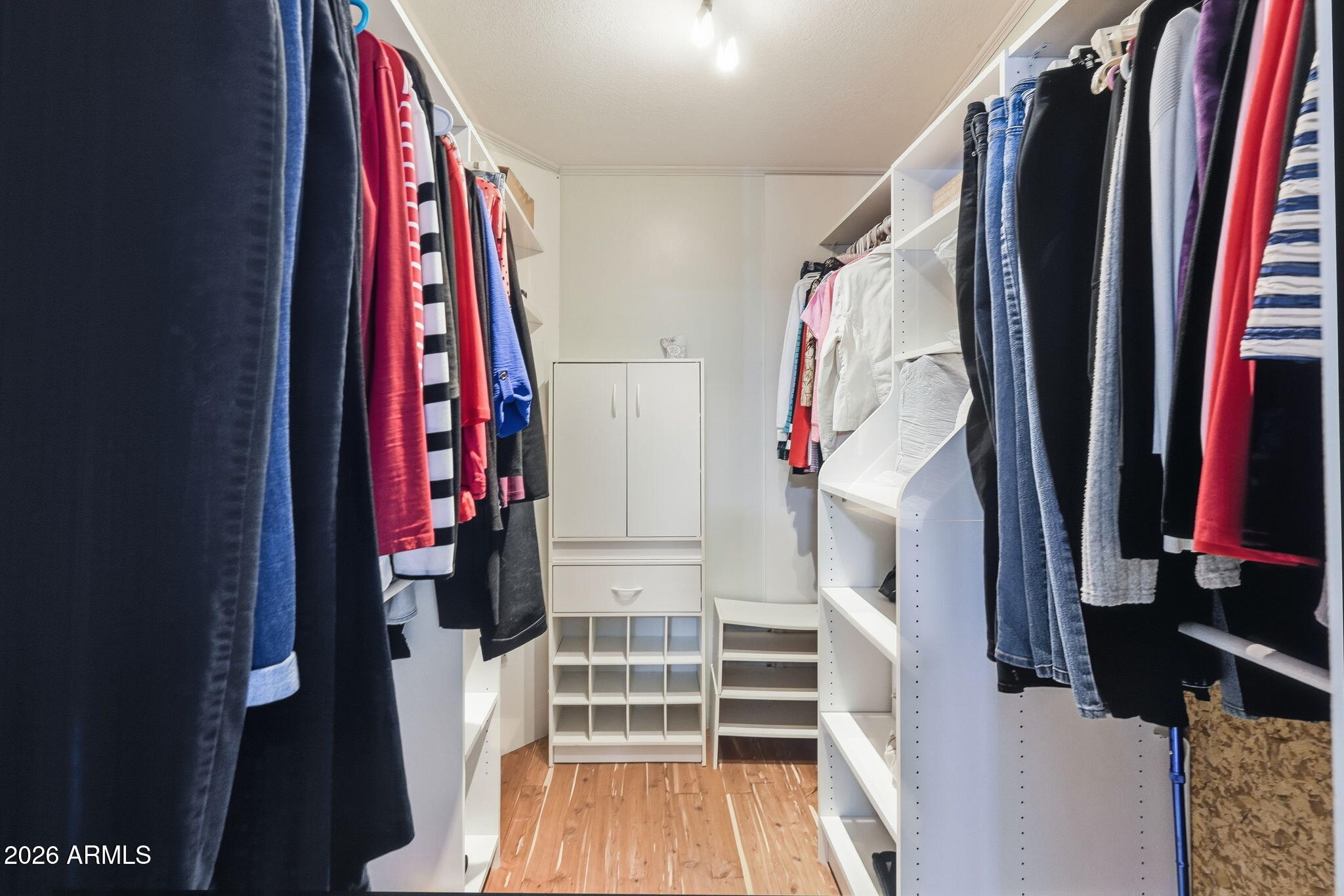 816 North Ridgeview Place Huachuca City, AZ 85616 - Photo 25 of 46 a view of walk in closet with clothes and shoes