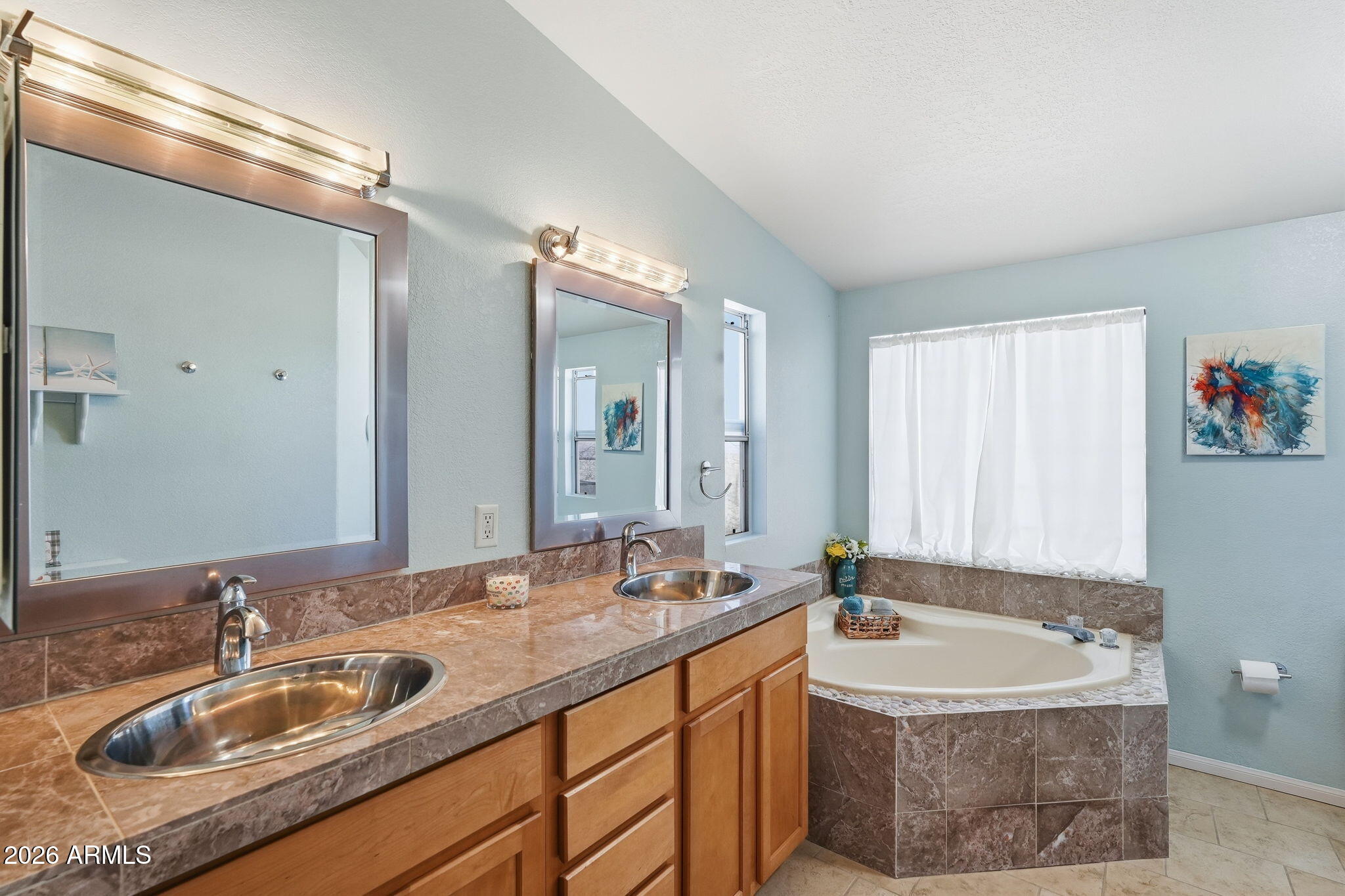 816 North Ridgeview Place Huachuca City, AZ 85616 - Photo 26 of 46 a bathroom with a sink and a mirror