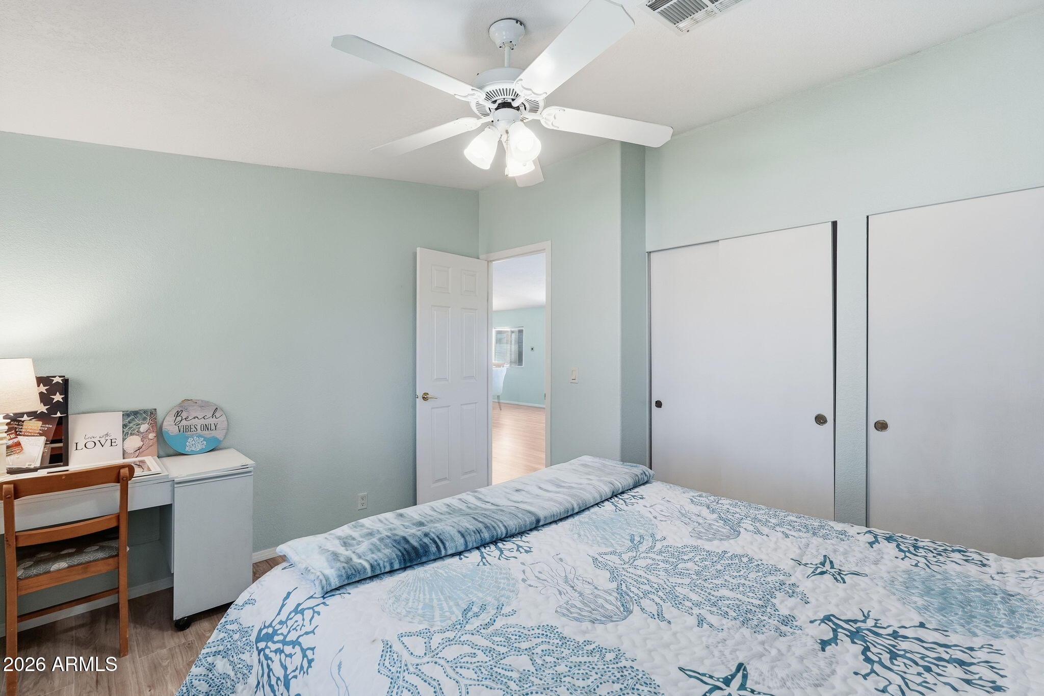 816 North Ridgeview Place Huachuca City, AZ 85616 - Photo 29 of 46 a bedroom with a bed and a chandelier