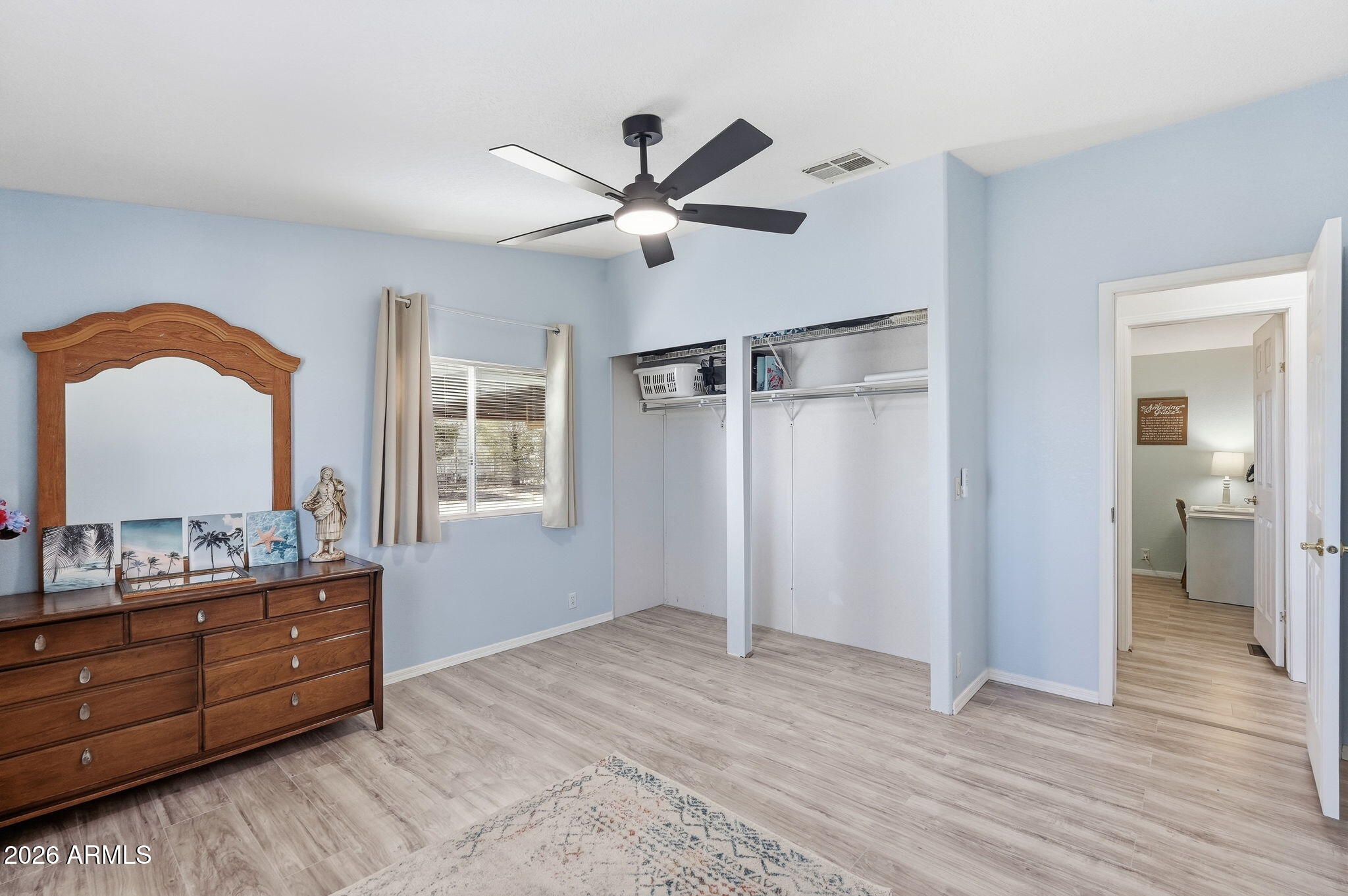 816 North Ridgeview Place Huachuca City, AZ 85616 - Photo 31 of 46 a bedroom with a bed and a mirror