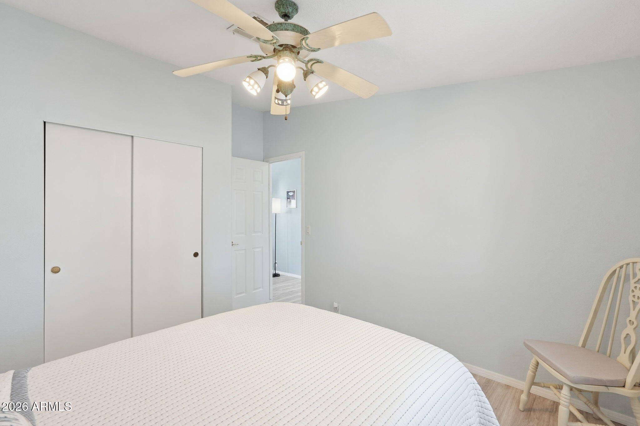 816 North Ridgeview Place Huachuca City, AZ 85616 - Photo 33 of 46 a bedroom with a bed and a chandelier