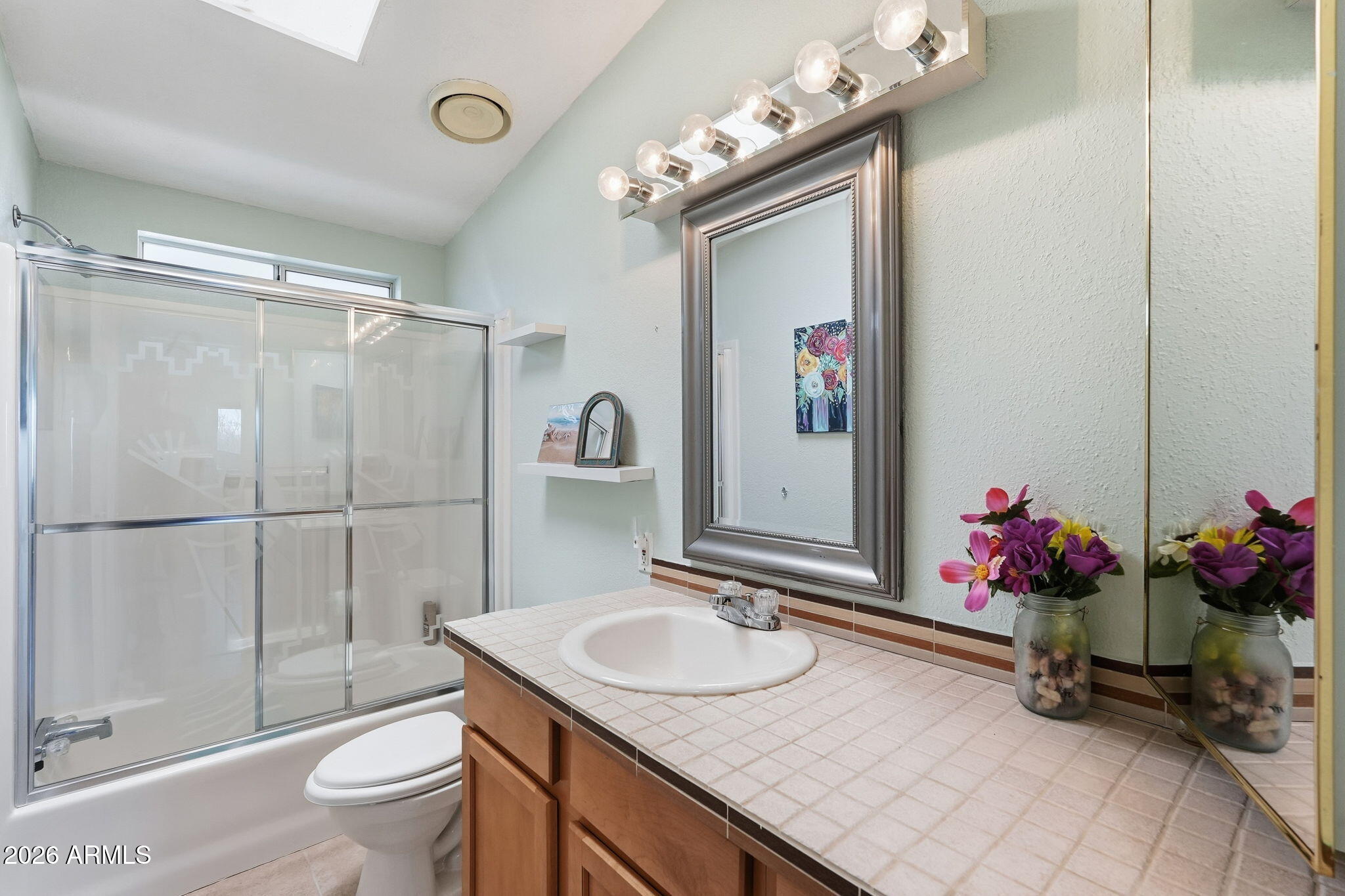 816 North Ridgeview Place Huachuca City, AZ 85616 - Photo 34 of 46 a bathroom with a sink vanity mirror and toilet