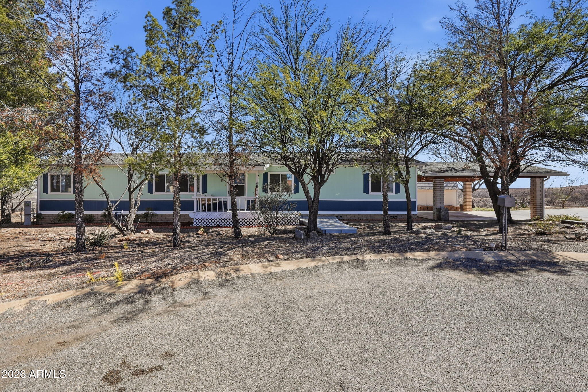 816 North Ridgeview Place Huachuca City, AZ 85616 - Photo 3 of 46 a view of house with trees in the background