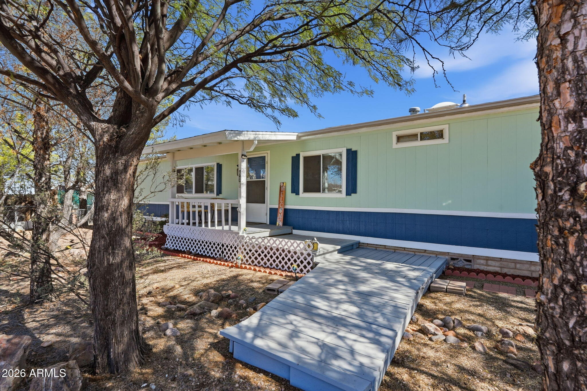 816 North Ridgeview Place Huachuca City, AZ 85616 - Photo 4 of 46 a view of a house with a small yard and wooden fence