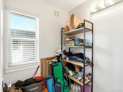 a bedroom with furniture and a window
